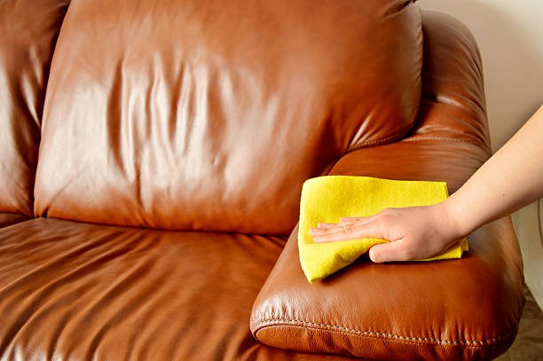 cleaning leather couch with yellow pad